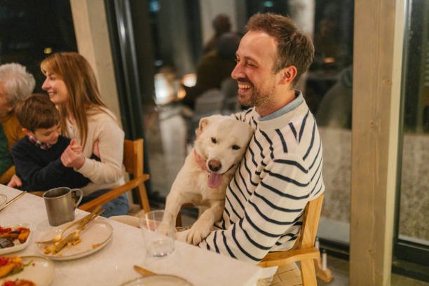 Photo of a family celebrating Thanksgiving at a cabin house
